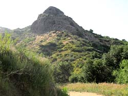 The cavernous sandstone mass of Bee Rock as seen from the east